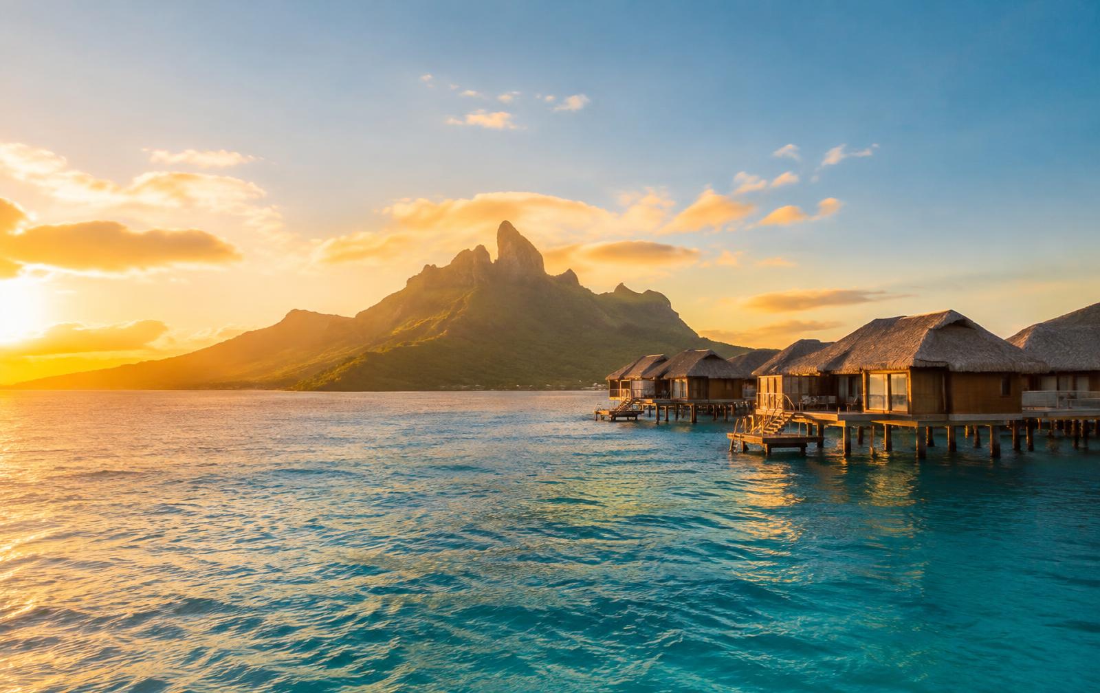 Overwater villas at sunset